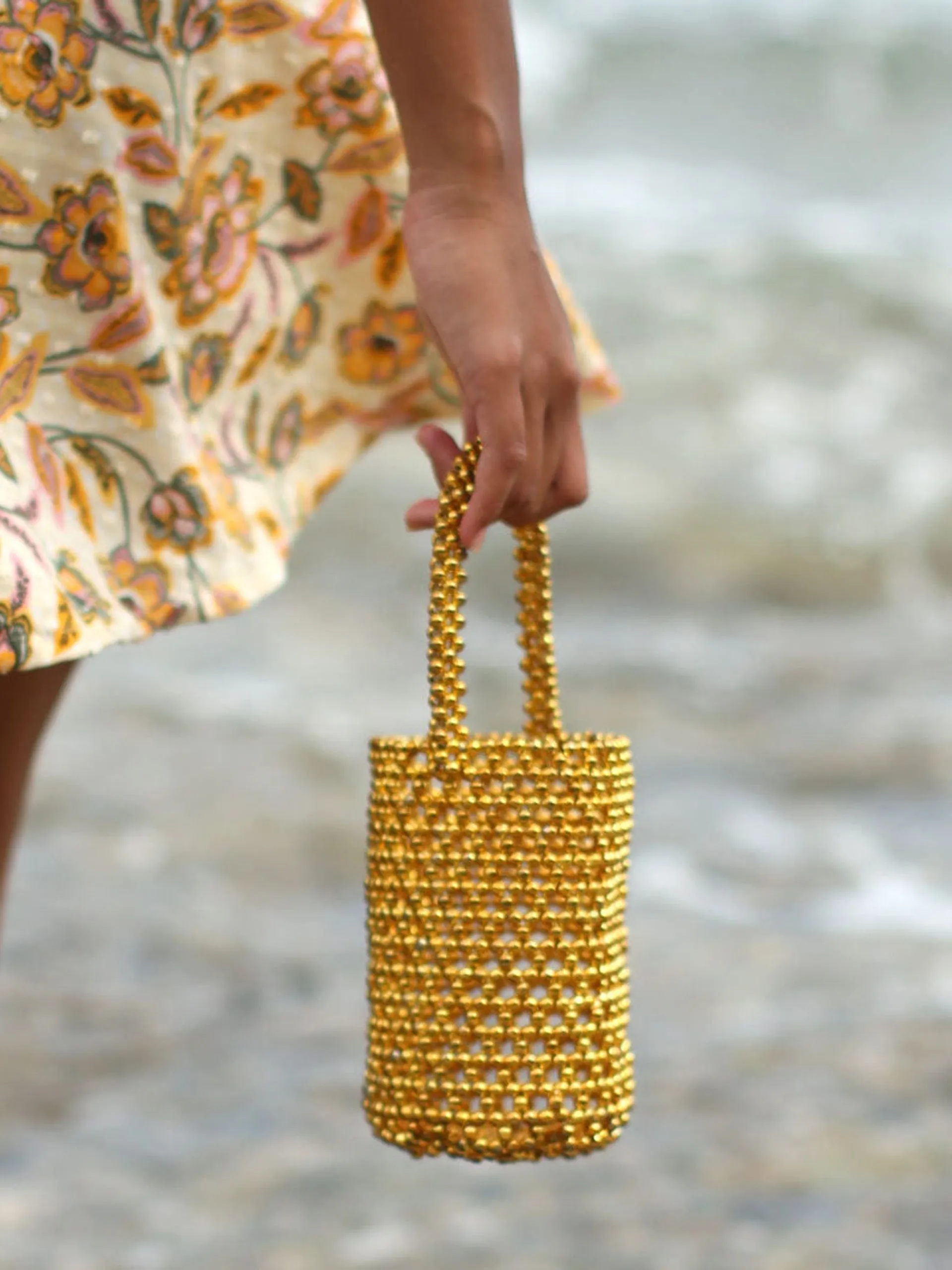 Golda metallic beads bucket bag in gold
