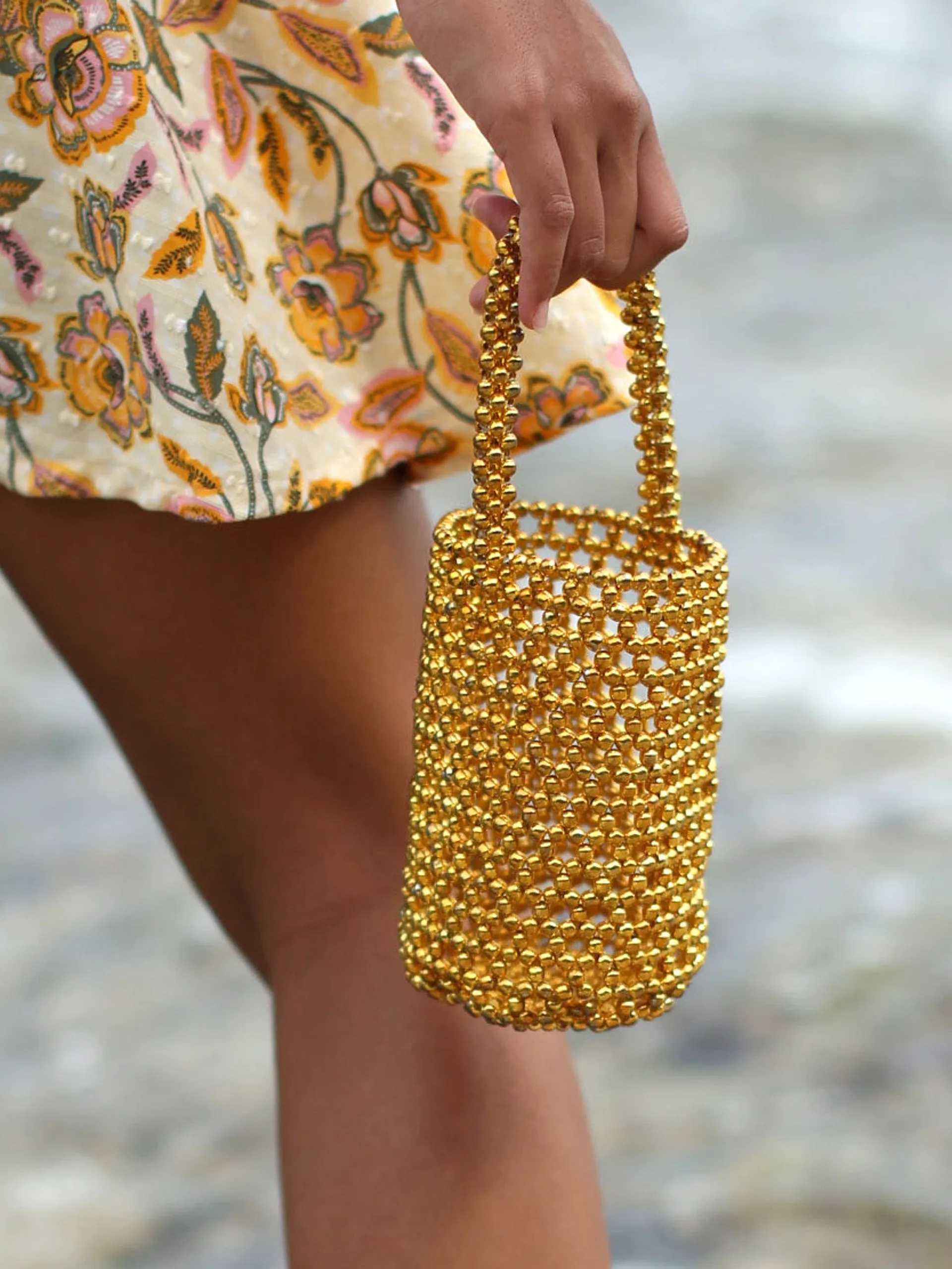 Golda metallic beads bucket bag in gold